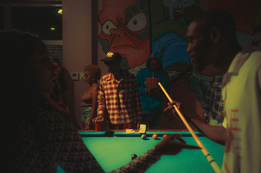 a group of people playing pool