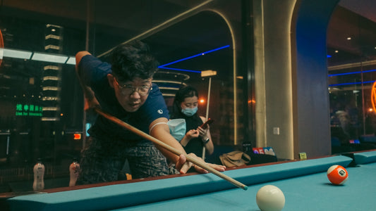 a person playing pool