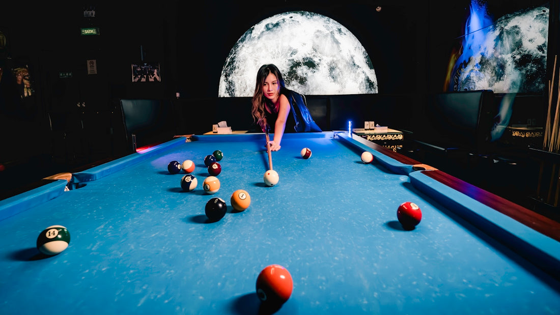 a woman is playing a game of pool