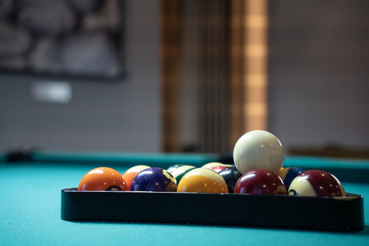 a pool table with a rack of pool balls