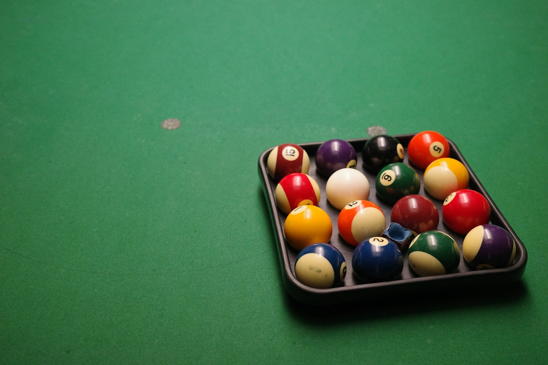 Rack of billiard balls on green felt